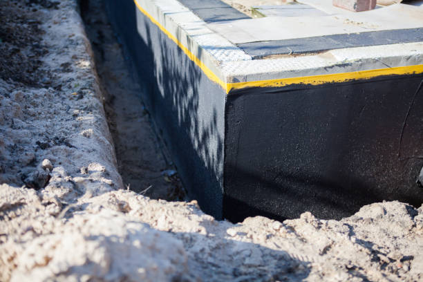 Professional Interior Drainage System technician working in Galesville, MD